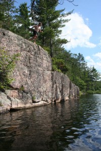 Man jumping from the highest part of the jumping rock