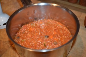 Soup in a pot with a braun hand blender.