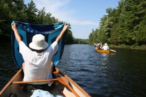 catching the wind in a canoe with a sarong