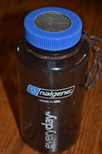 Nalgene bottle with mesh lid.