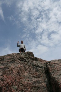 Man on top of a cliff.