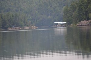 Plane landing on Cox Lake.