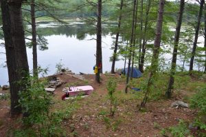 Looking down on a campsite and lake.