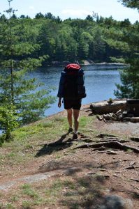 woman walking with backpack