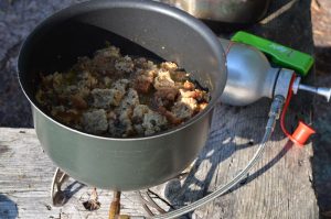 Casserole in a pot on a camp stove