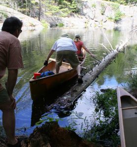 launching a canoe from a log