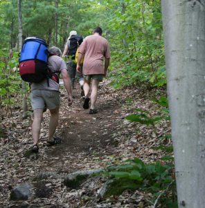 Three people on a portage