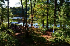 view from a hill down on a campsite.