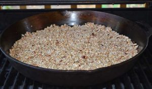 Granola witout fruit in pan on barbecue