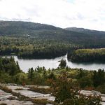 Lake, rocks and trees and rolling hills