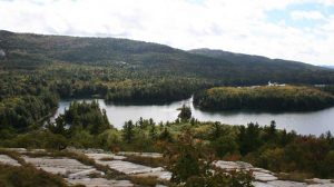 Lake, rocks and trees and rolling hills