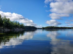 Blue sky, white clouds looking up the lake