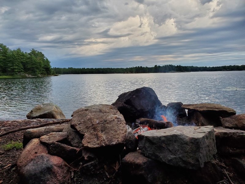 Campfire with strange gray clouds.