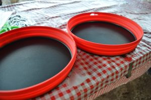 red plates on a picnic table