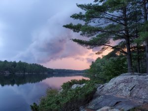 Storm cloud with pick sky and lake