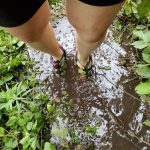 woman's feet in mud