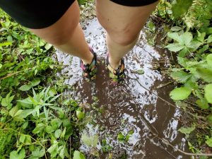 woman's feet in mud